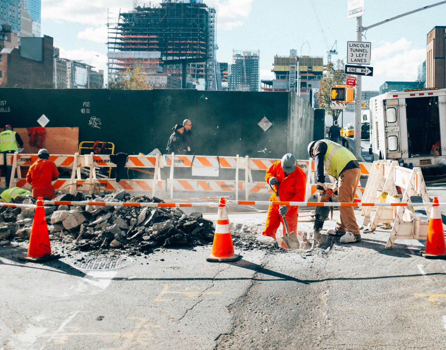 A crew repairing an urban street